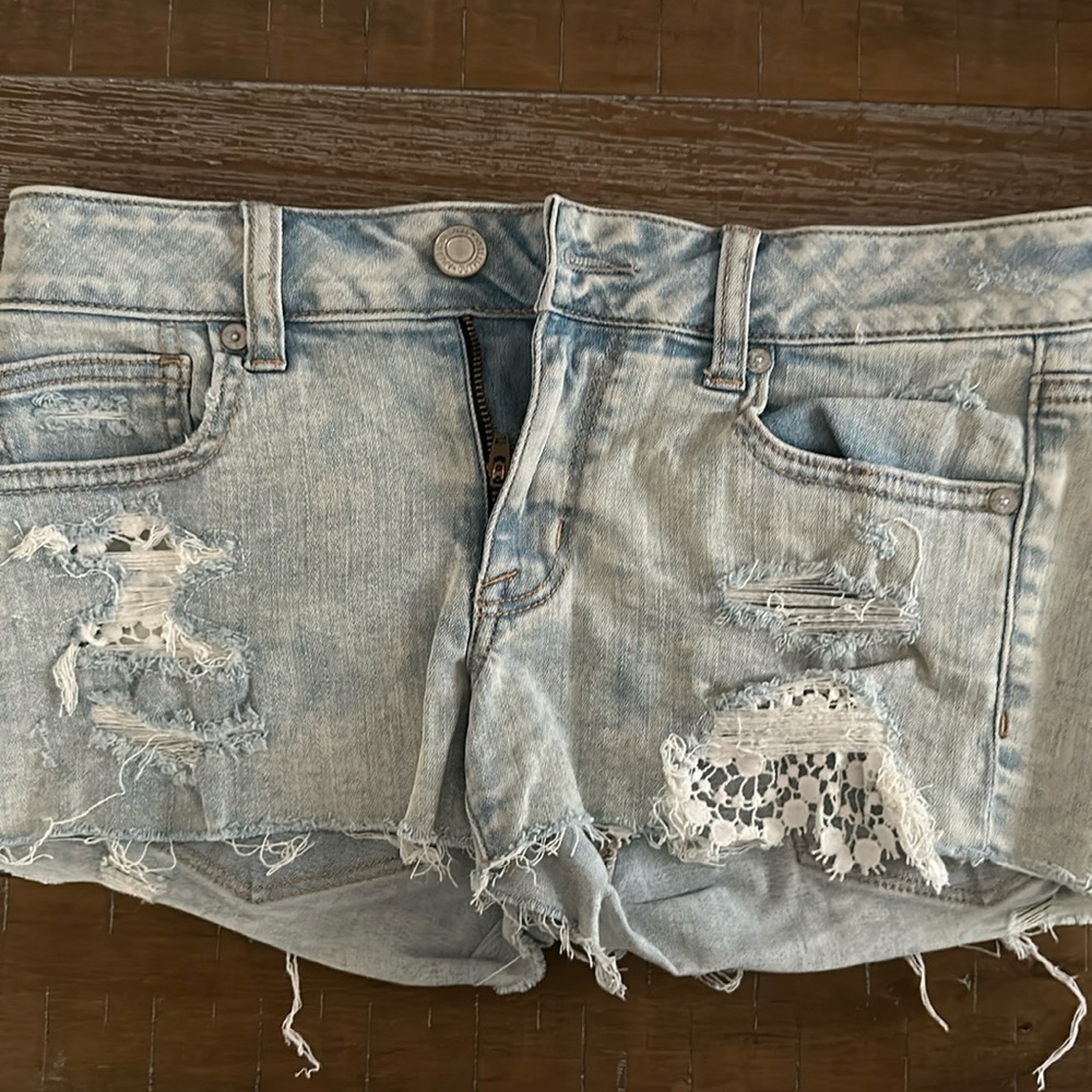 American Eagle size 6 distressed, jean shorts with little bit of lace